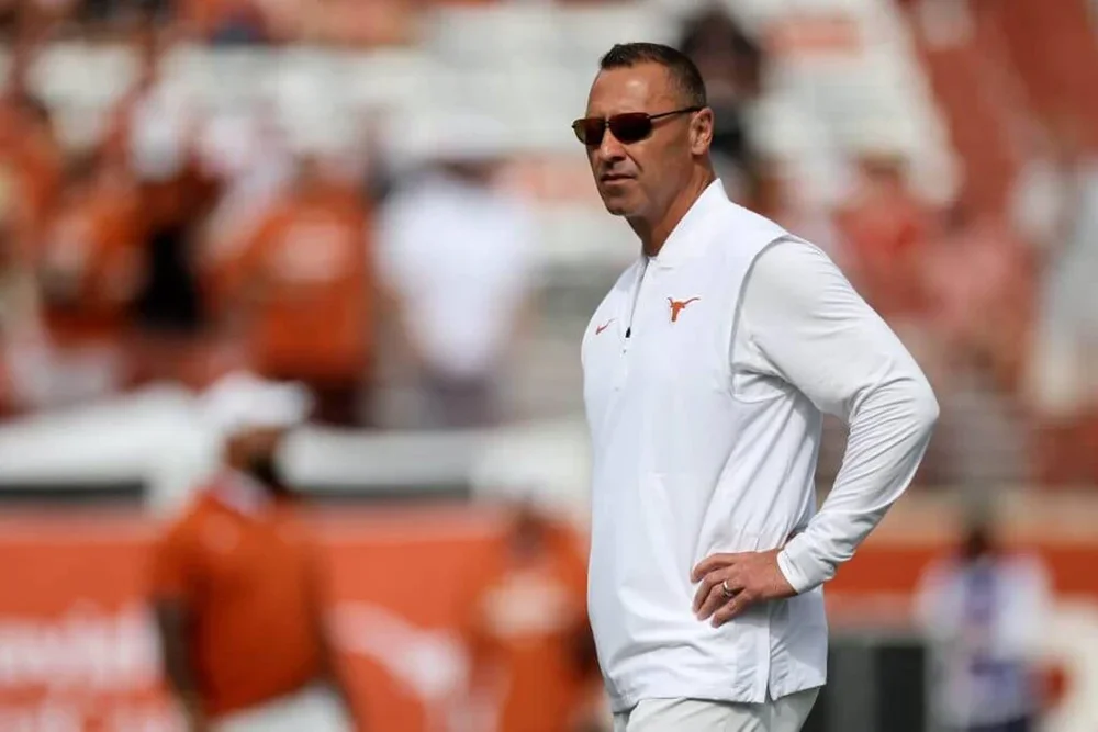 Steve Sarkisian watches his Texas players warm up before a game.